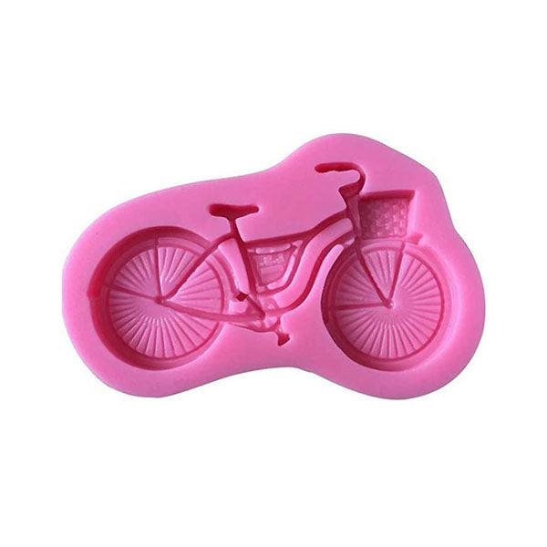 A pink silicone mold shaped like a bicycle, featuring detailed designs of the bike&