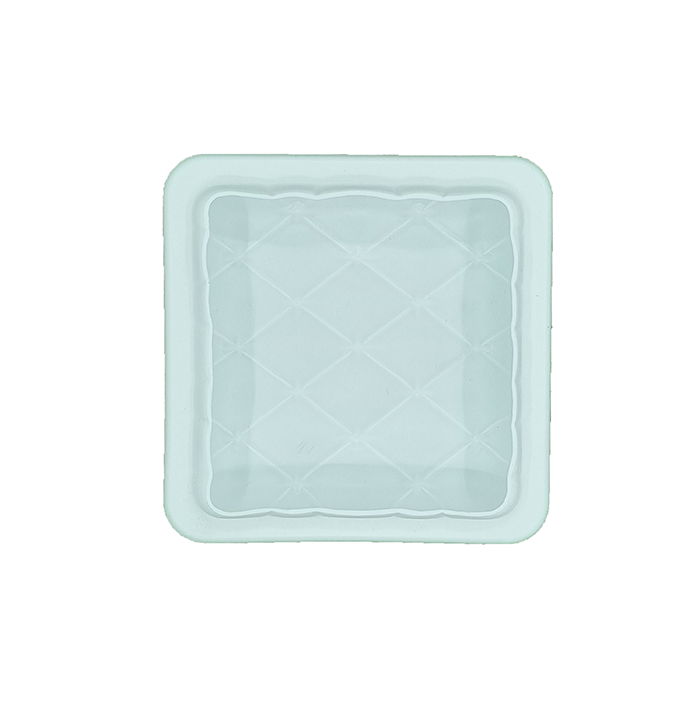 A square silicone mold shaped like a pillow, featuring a quilted texture with diamond patterns. The mold is white with a subtle sheen and has a smooth interior surface.