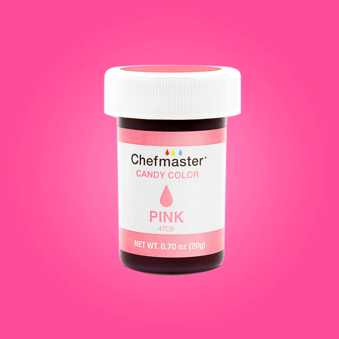 A container of Chefmaster candy color in pink. The jar has a white lid and a label that reads &quot;Chefmaster Candy Color Pink&quot; with a droplet graphic. The net weight is indicated as 0.70 oz (20g). The background is a solid pink color.