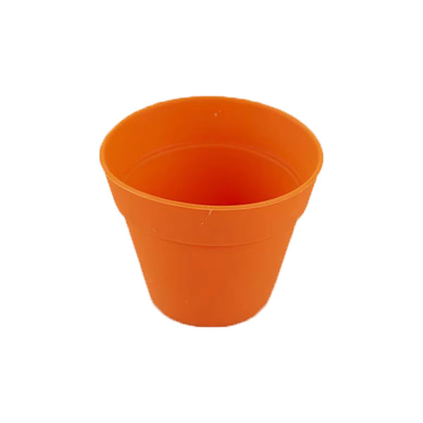 An orange silicone mould shaped like a small plant pot, featuring a rounded top and tapered sides. The interior is smooth and the exterior has subtle lines indicating the pot&