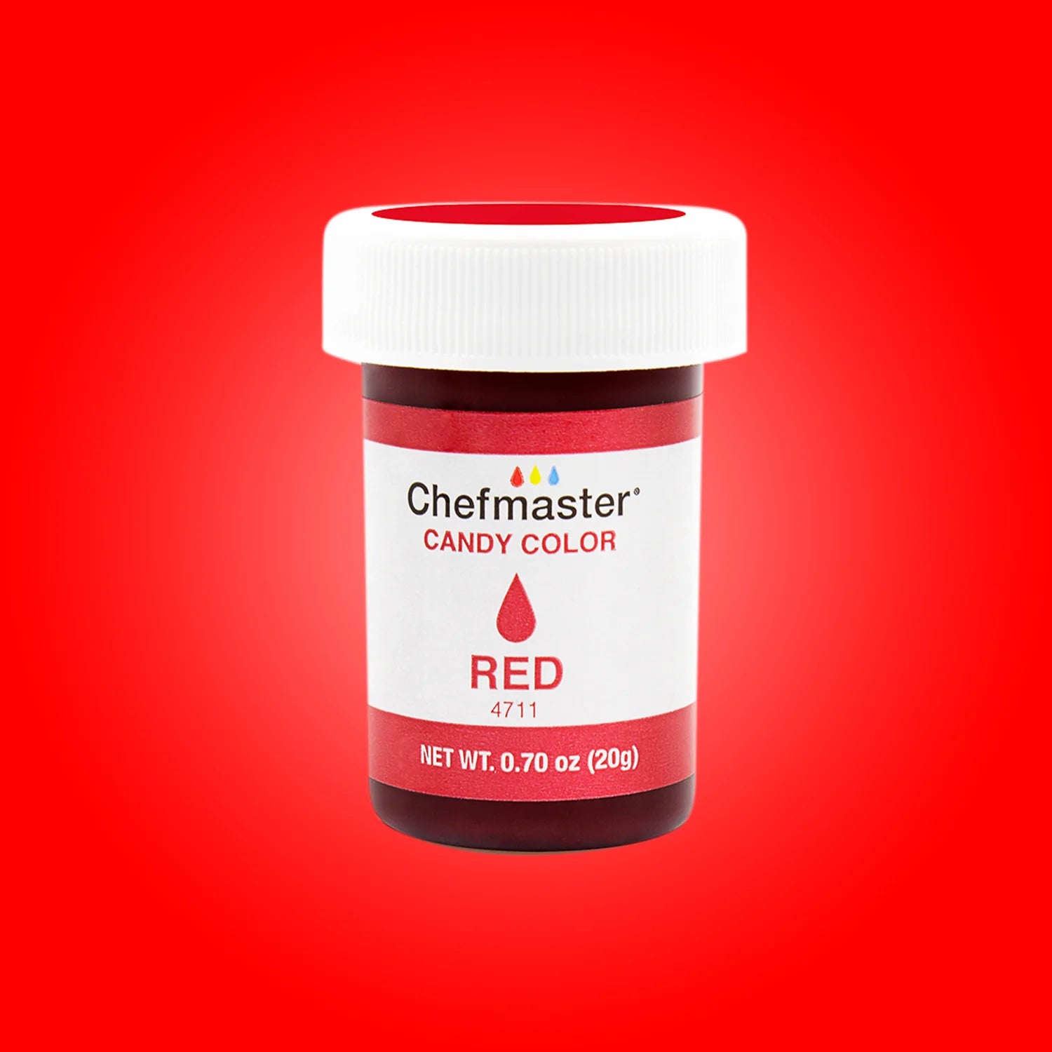 A jar of Chefmaster Candy Color in red, labeled &quot;RED&quot; with a droplet icon, sits against a vibrant red background. The jar has a white lid and features a label indicating the product name and weight (0.70 oz or 20g). The design includes the Chefmaster logo and a small color palette above the name.