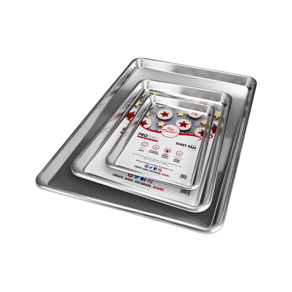 The image features a set of four metal sheet pans of varying sizes stacked on top of each other. The pans are shiny and rectangular, showcasing their smooth surfaces and rounded edges. The smallest pan in the center has a branded label on the bottom with the name &quot;Fat Daddio&