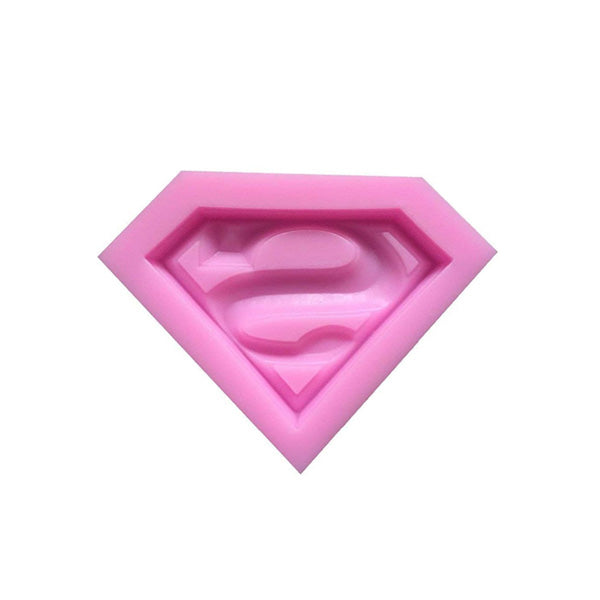 A pink silicone mold in the shape of a diamond with a stylized "S" logo in the center, resembling a superhero emblem. The mold is designed for creating shaped desserts or crafts.