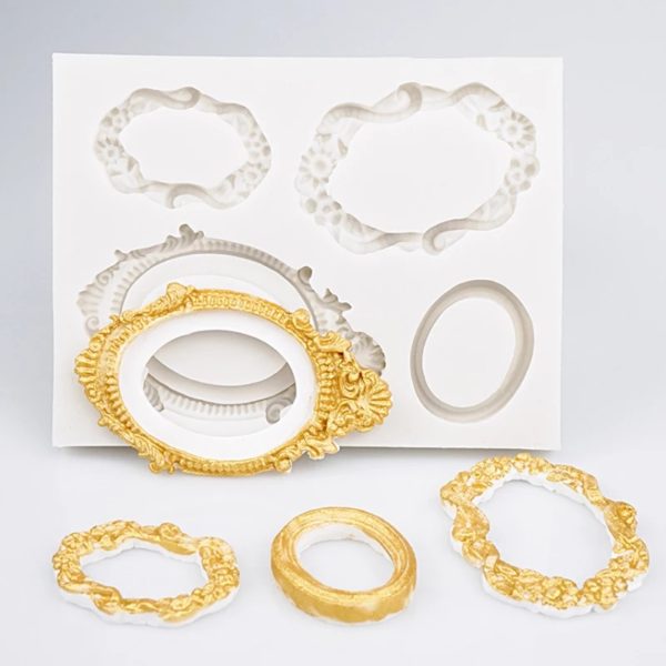 The image shows a silicone mold set designed for creating vintage mirror frames. It features a white backing with several mold shapes, including ornate frames in various styles and sizes. In the foreground, three completed frames are displayed: one is gold with intricate detailing, while the other two are gold and white, showcasing different designs. The molds appear to be flexible and are suitable for crafting decorative frame replicas.