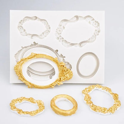 The image shows a silicone mold set designed for creating vintage mirror frames. It features a white backing with several mold shapes, including ornate frames in various styles and sizes. In the foreground, three completed frames are displayed: one is gold with intricate detailing, while the other two are gold and white, showcasing different designs. The molds appear to be flexible and are suitable for crafting decorative frame replicas.