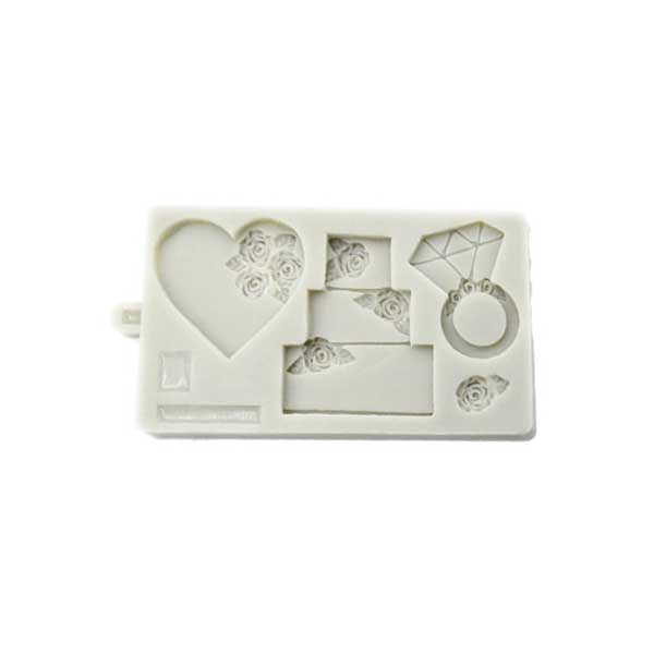A silicone mould featuring various shapes related to a wedding theme. The mould includes a heart shape with floral details, three stacked cake shapes with rose designs, a diamond ring shape, and a diamond shape. The entire mould is light in color and has a smooth surface.