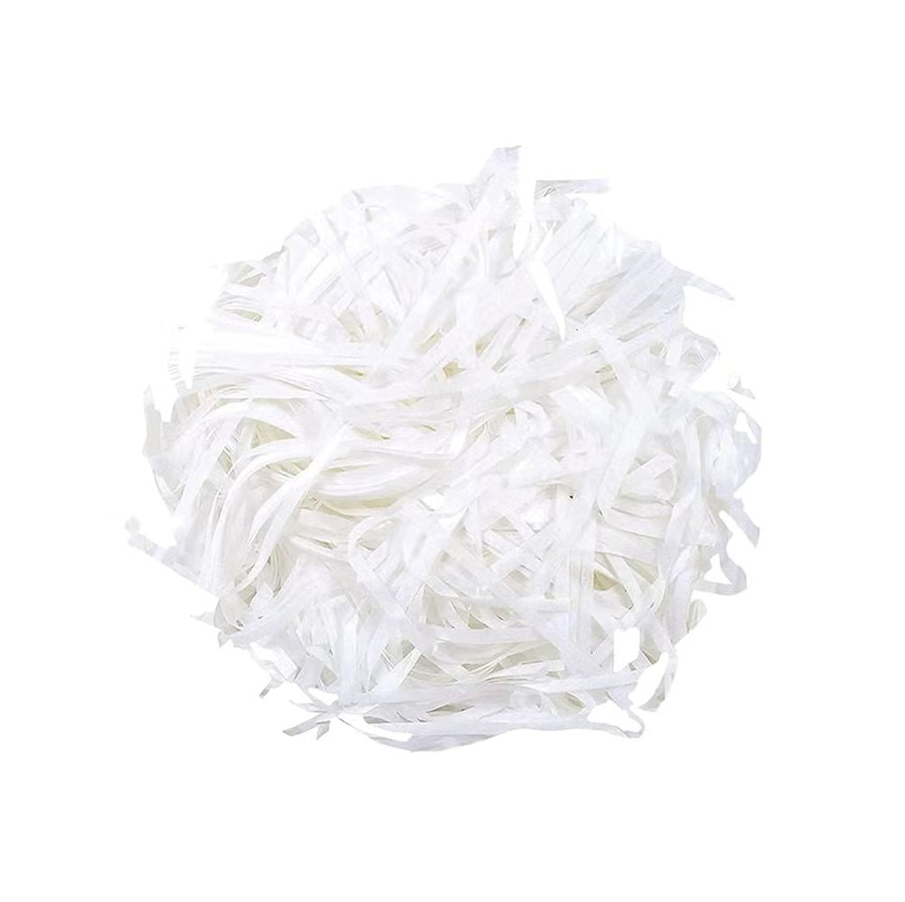 A mound of white shredded paper is displayed against a plain white background, emphasizing its delicate texture.