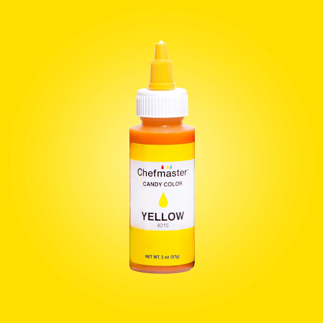 Image of a bottle of Chefmaster Candy Color in yellow, labeled clearly with the product name &quot;Chefmaster Candy Color&quot; and the color &quot;YELLOW.&quot; The bottle is 2 oz (57 g) and features a pointed cap for easy dispensing. The background is a vibrant yellow gradient, enhancing the visibility of the product.