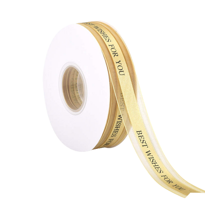 A roll of ribbon featuring a white background with the text "BEST WISHES FOR YOU" printed in black. The ribbon is 2.5 cm wide and has a length of 5 yards. It is displayed on a circular spool, with a portion of the ribbon unspooled and draping to the side. The overall appearance is elegant and suitable for gift wrapping or decorative purposes.