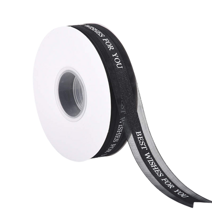 A roll of ribbon that is 2.5 cm wide and 5 yards long. The ribbon is white with the printed text "BEST WISHES FOR YOU" in black. The roll is displayed on a white background, showing part of the ribbon unspooled.