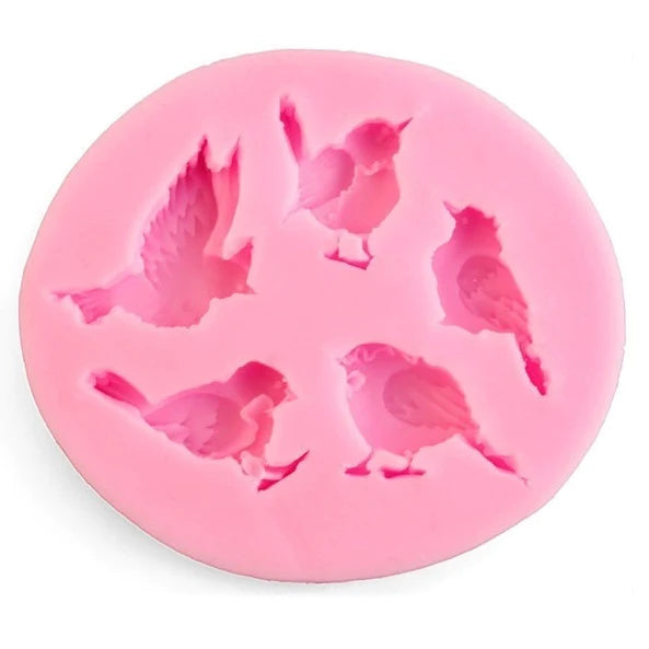 A round, pink silicone mold featuring five bird shapes in various poses. Each bird design is outlined, showcasing details like wings and body positions, suitable for crafting or baking purposes. The mold is flexible and has a smooth surface, ideal for use with materials like resin or chocolate.