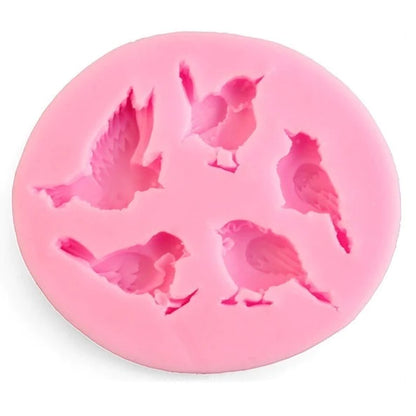A round, pink silicone mold featuring five bird shapes in various poses. Each bird design is outlined, showcasing details like wings and body positions, suitable for crafting or baking purposes. The mold is flexible and has a smooth surface, ideal for use with materials like resin or chocolate.
