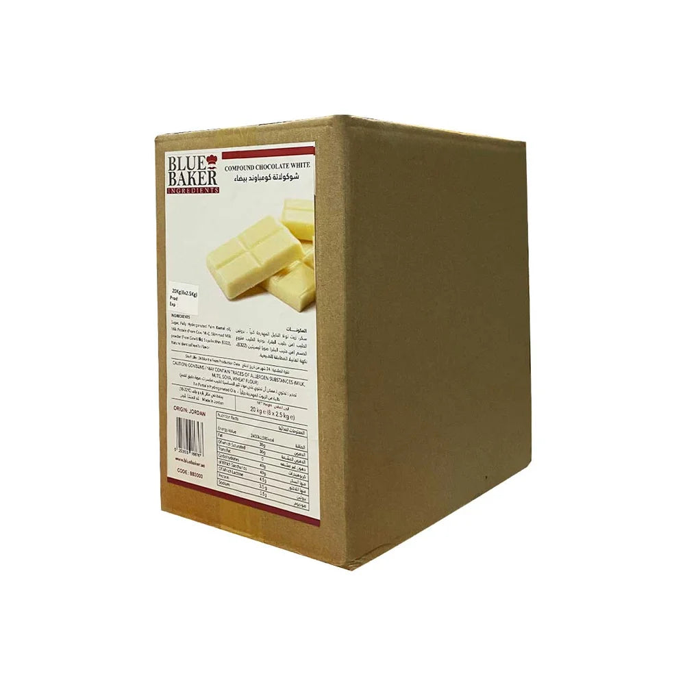 A cardboard box labeled "Blue Baker White Chocolate Compound Block" weighing 2.5 kg. The front of the box features an image of white chocolate pieces and includes product information and nutritional details on one side. The packaging is plain brown, with the label prominently displayed.