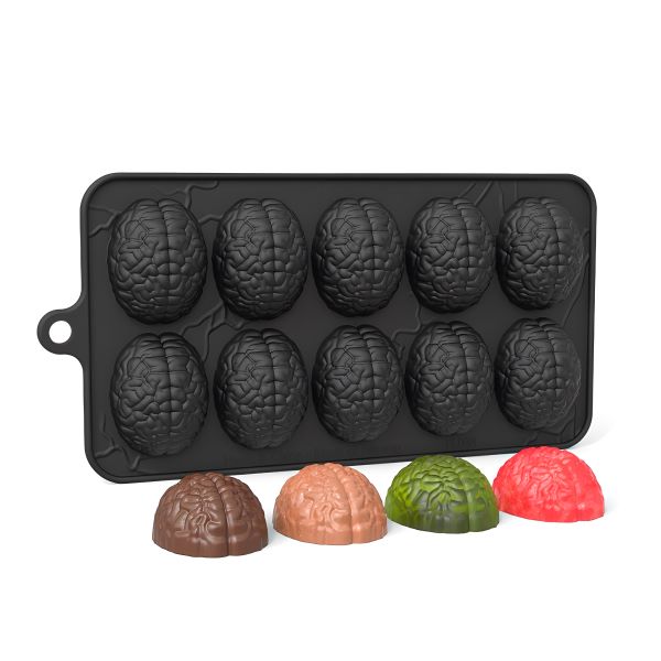 A black silicone mould with 10 cavities shaped like brain halves is shown. The mould contains three completed brain-shaped treats in brown, orange, and green, sitting on the surface beside it. The mould itself is designated for creating brain-shaped chocolates or desserts.