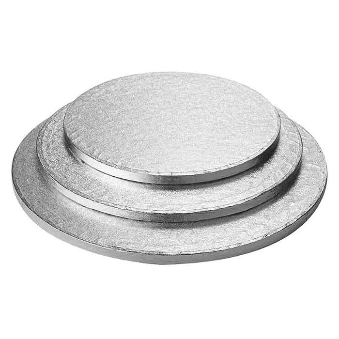 Three round silver cake drum boards of varying sizes stacked on top of each other, featuring a slightly shiny metallic surface. The boards have a thick, sturdy appearance, suitable for supporting multi-tiered cakes.