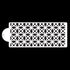 The image displays a rectangular cake stencil featuring a geometric pattern consisting of interlocking star shapes. The stencil is white against a black background, showcasing intricate designs that can be used for decorating cakes or other confections. One end of the stencil has a rounded hole for easy handling or attachment.