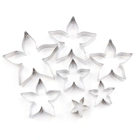 &quot;Set of seven metal cookie cutters in the shape of flowers, ranging in size from small to large. The cutters have sharp edges and a shiny silver finish, featuring a floral design with pointed petals.&quot;