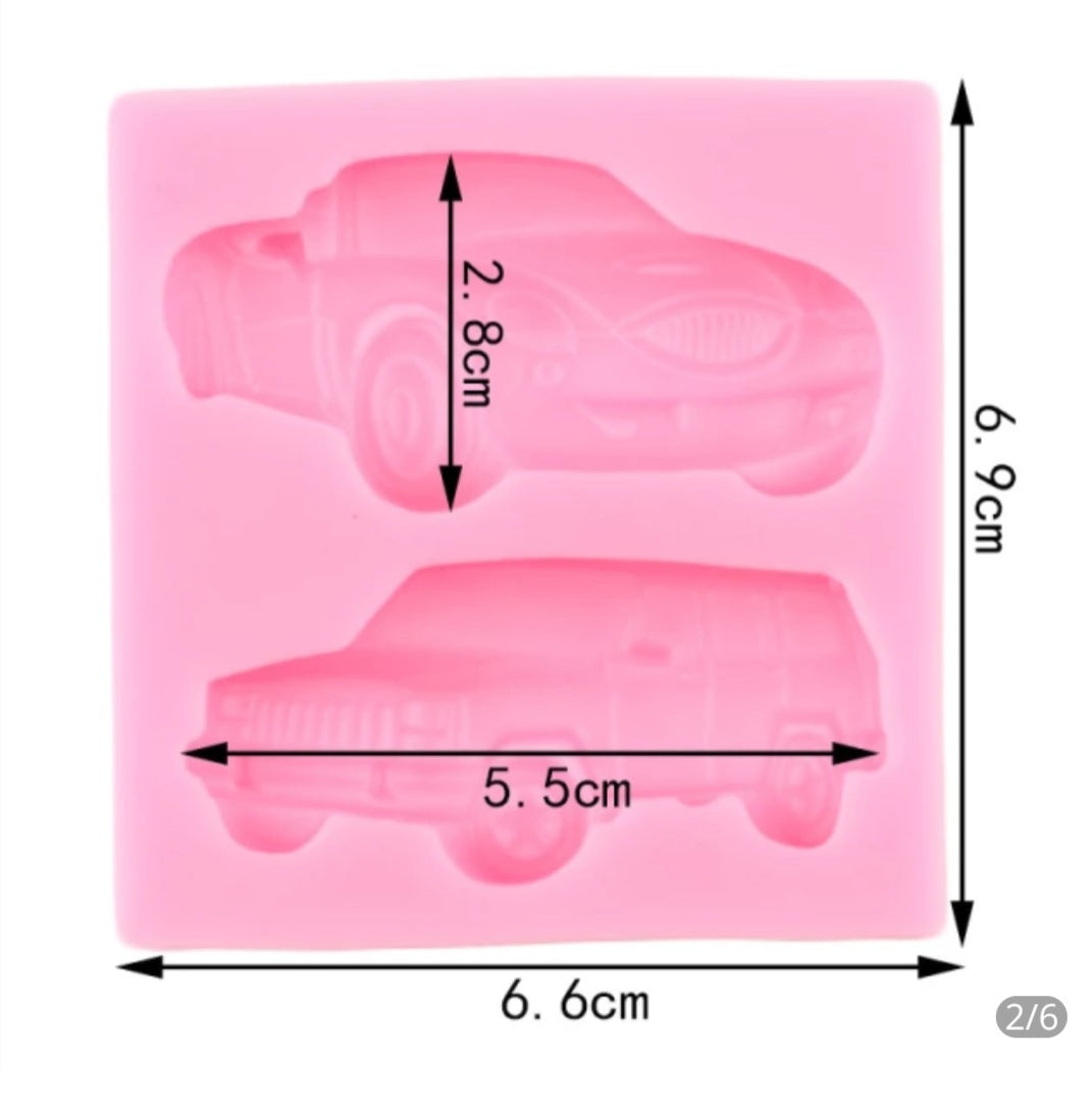 A pink silicone mold featuring two car shapes. The mold measures 6.6 cm by 6.9 cm, with the top car shape measuring 5.5 cm in width and 2.8 cm in height. The design includes a sports car on the top and an SUV-like vehicle on the bottom.
