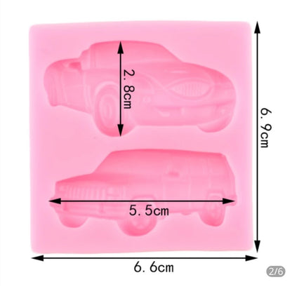 A pink silicone mold featuring two car shapes. The mold measures 6.6 cm by 6.9 cm, with the top car shape measuring 5.5 cm in width and 2.8 cm in height. The design includes a sports car on the top and an SUV-like vehicle on the bottom.