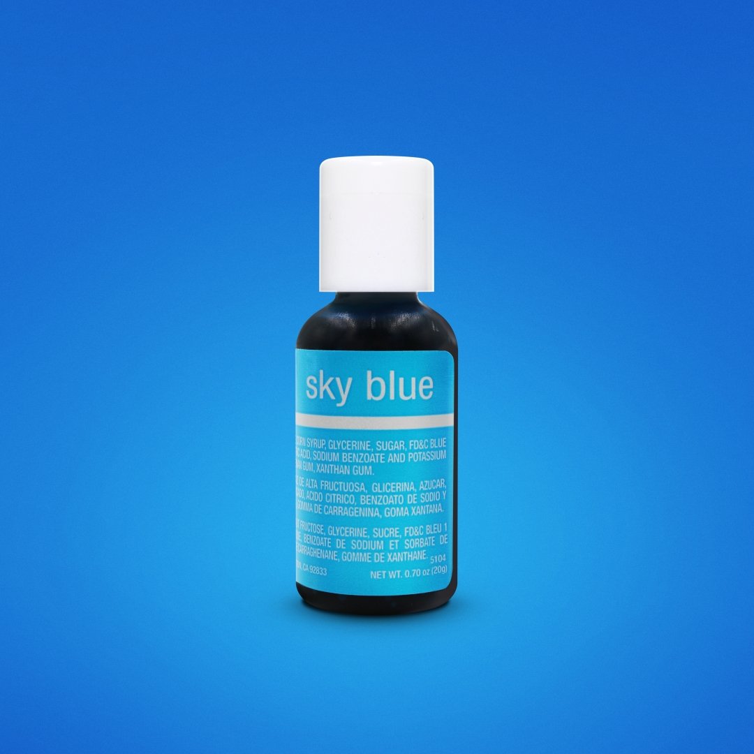 A bottle of Chefmaster Liqua Gel color in sky blue is displayed against a blue background. The bottle is black with a white cap and features a prominent label in light blue text that reads "sky blue." The label includes ingredient information and product details. The bottle contains 0.7 oz (20 ml) of liquid gel color.