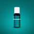 A small bottle of teal green gel food coloring with a white cap. The bottle is labeled "teal green" in a prominent, bold font on the front. The background is a solid, rich teal color. The label includes additional product information and ingredients listed in smaller text. The bottle has a net weight of 0.7 oz (20 ml).
