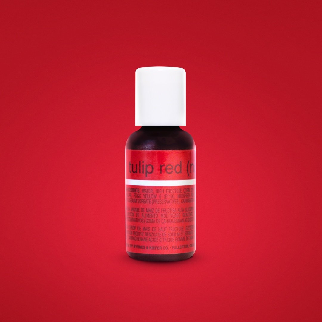 A bottle of Chefmaster Liqua Gel color in "Tulip Red," featuring a white cap and a label displaying its name and ingredients. The bottle is set against a solid red background. The label has text in English and Spanish. The bottle holds 0.7 oz (20 ml) of the product.