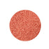 A circular mound of tiny, pinkish-orange sugar sprinkles, densely packed and uniform, creating a playful and sweet appearance.