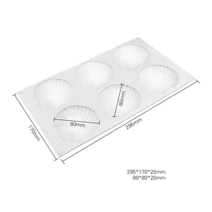 A white silicone mould featuring six shell-shaped cavities arranged in two rows. The mould dimensions are 295mm by 170mm and the shell cavities measure 80mm by 20mm. There are measurement markings along the sides of the mould.