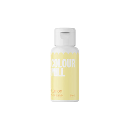 A bottle of Colour Mill oil-based food color in lemon flavor, 20ml. The bottle has a light lemon-yellow label with bold white text that reads "COLOUR MILL" and "Lemon" in a smaller font. The label also indicates it is an "OIL BLEND" and displays the volume as "20mL." The bottle has a white cap. The background is plain and dark, highlighting the product.