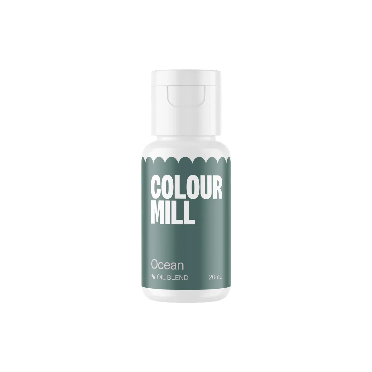 White bottle of "Colour Mill" oil blend labeled "Ocean," in white text over a deep teal background. Bottle is centered on a black backdrop.