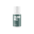White bottle of "Colour Mill" oil blend labeled "Ocean," in white text over a deep teal background. Bottle is centered on a black backdrop.