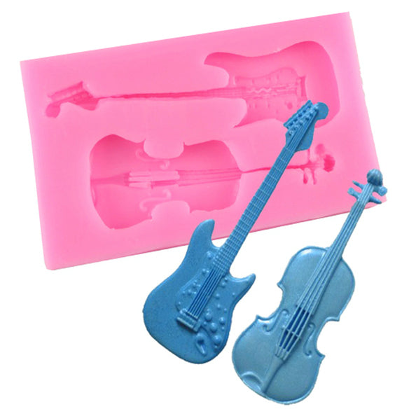 The image features a pink silicone mold designed for creating shapes of a guitar and a violin. The mold showcases indentations of both instruments, with the guitar positioned horizontally and the violin vertically. Next to the mold are two completed castings: a blue guitar and a blue violin, each with detailed features, including strings and body outlines. The overall composition emphasizes the mold alongside its output products, highlighting the theme of music-related crafting.