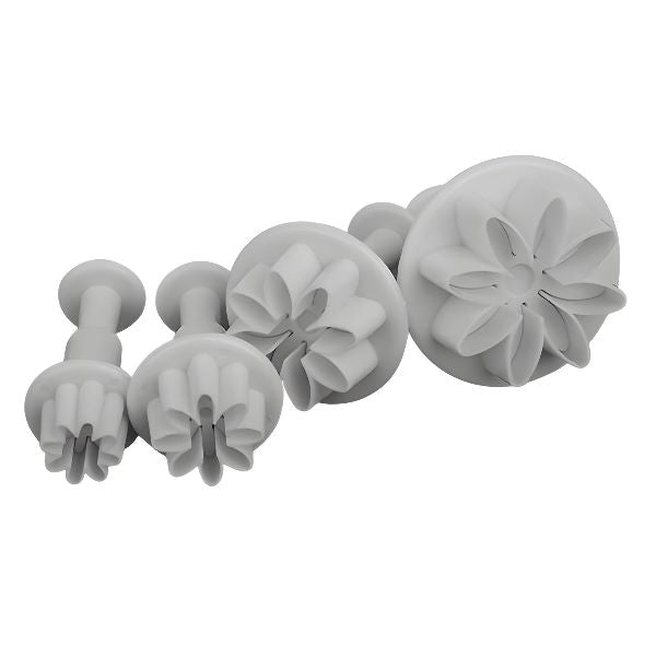 A set of four plunger cutters designed for shaping dough or icing into daisy flower shapes. The cutters are made of white plastic and vary in size, with each cutter featuring a distinct daisy flower design on the cutting edge. The largest cutter is on the right and the smallest is on the left, arranged in order of size.