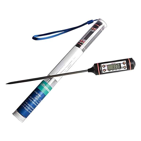 An image shows a digital candy thermometer, which includes a sleek, elongated probe with a digital display on the handle. The thermometer is positioned next to its packaging, which is a cylindrical tube featuring various labels and a blue strap attached to the top. The digital display shows a temperature reading, and the overall color scheme is predominantly black, silver, and blue.