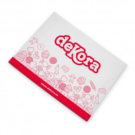 The image shows a package of edible icing sheets. The packaging features the brand name &quot;deKora&quot; in bold red letters at the top. Below the brand name, there is a red section decorated with various illustrations of baking-related items, such as hearts, cupcakes, and other sweet treats. The overall color scheme is primarily light gray with red accents.