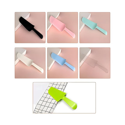 A grid of six pastel and black kitchen knives on pink surfaces, with a single bright green knife on a white and black grid tablecloth below.