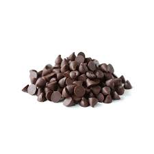 A pile of dark chocolate chips, resembling small chocolate teardrops, against a plain background. The chips vary in size and are shiny, indicating a rich chocolate texture. This image represents &