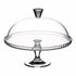 A clear glass cake display stand featuring an elegant dome cover. The stand has a round, scalloped edge and a sturdy pedestal base, with a round knob on top of the dome for easy lifting. The entire piece is made of transparent glass, showcasing the cake or desserts inside.