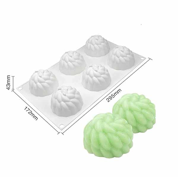 An image of a white silicone mold shaped like chrysanthemum flowers with six cavities. The mold measures 295mm by 172mm and has a height of 43mm. Two finished green floral-shaped desserts are placed beside the mold, showcasing the design.