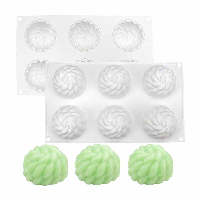 An image featuring two silicone moulds designed in the shape of chrysanthemum flowers, each with six cavities. The moulds are white and show intricate floral details. In front of the moulds, there are three finished products in a light green color resembling the chrysanthemum flower shape, demonstrating the mould&
