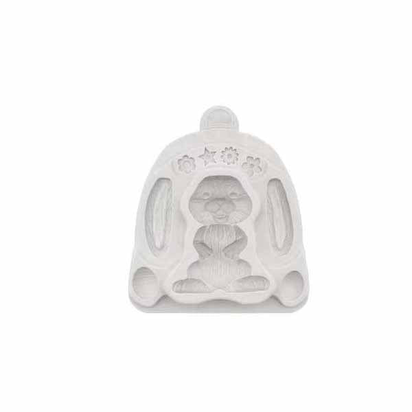 A white silicone mold shaped like a sitting rabbit, featuring detailed designs for the rabbit&