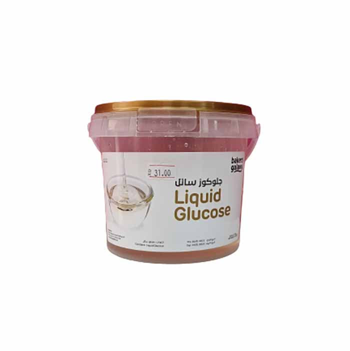 A plastic container of liquid glucose with a gold lid. The label features the text "Liquid Glucose" in both English and Arabic, along with a price tag showing "P. 31.00." The container has a transparent section revealing the syrup inside.
