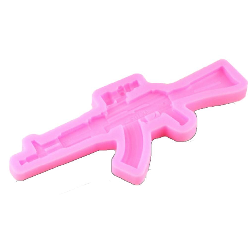 A pink silicone mold in the shape of a rifle, designed for crafting or baking purposes. The mold features detailed contours that resemble the body of the gun, including the barrel and stock, and is set against a plain background.