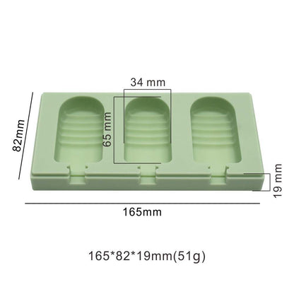 A green silicone mould designed for making half strip cakesickles with three cavities. The mould dimensions are labeled as 165mm in length, 82mm in width, and 19mm in height. Each cavity measures 65mm in length and 34mm in width. The mould features a smooth surface and ridged edges inside each cavity.