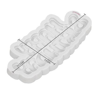 A white silicone mould shaped like the words "Happy Birthday." The mould has a wavy edge and measures approximately 12.3 cm in length and 5.3 cm in width. It is displayed at a slight angle to show its depth and design.