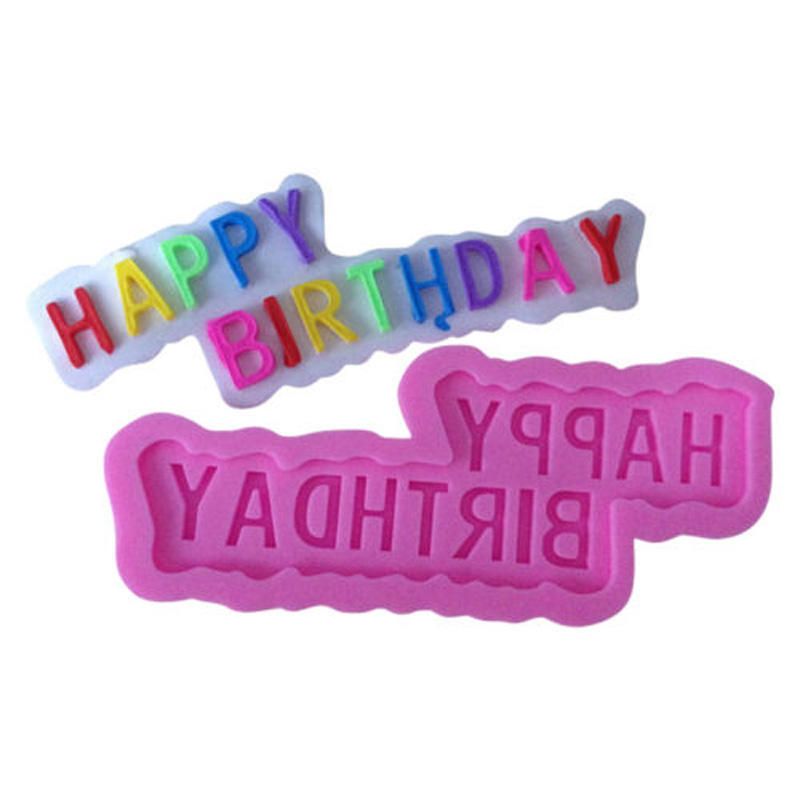 Two silicone molds for cake decorating. The top mold features the colorful letters "HAPPY" and "BIRTHDAY" in various bright colors on a white background. The bottom mold is pink and contains the embossed words "HAPPY" and "BIRTHDAY" in a playful font.