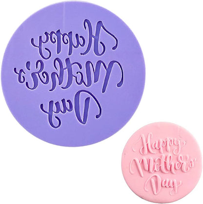 The image features a purple fondant embosser cookie stamp and a pink fondant piece. The embosser has an intricate design, textually stating "Happy Mother&