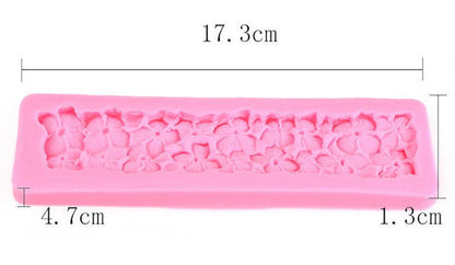 A pink silicone mould designed for hydrangea flowers, measuring 17.3 cm in length, 4.7 cm in width, and 1.3 cm in height. The mould features detailed flower patterns of hydrangeas embossed on its surface.