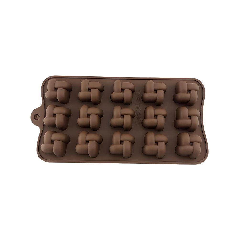 A chocolate mold displaying an assortment of shapes, such as flowers, animals, and geometric forms for chocolate making.