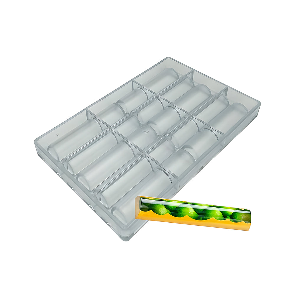 Clear rectangular mold with twelve long, semicircular cavities beside a shiny, green and yellow patterned chocolate bar. Sleek and modern style.